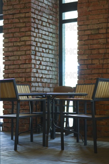 Small table with chairs around it in grunge bar