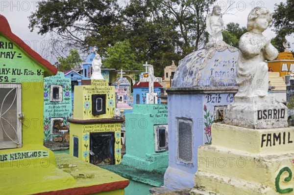 Colourful memorials, gravestones and tombstones at Hoctún Cemetery near Mérida, Yucatán, Mexico,