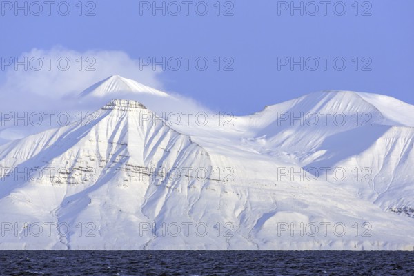 Snow covered mountains at Billefjorden, central fjord of the Isfjorden, Svalbard, Spitsbergen,