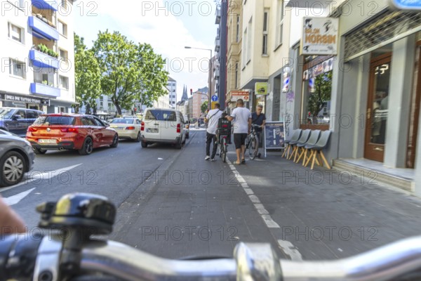Cycling from a first-person perspective on a cycle path in Cologne, North Rhine-Westphalia,