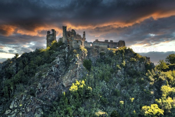 Village of Saint-Remy-de-Biot, the medieval castle in ruins of Chateau Rocher at sunset (15th