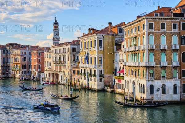 VENICE, ITALY, JUNE 27, 2018: Grand Canal with boats and gondolas on sunset, Venice, Italy, Europe