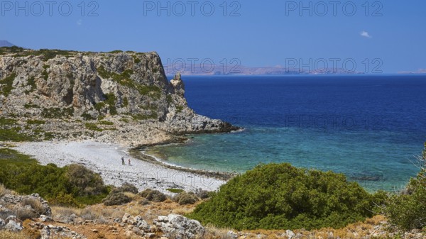 Agios Pavlos beach, pebble beach, barren rocks, trees, blue sea, green sea, Gramvoussa peninsula,