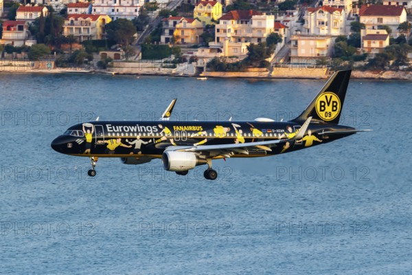 A Eurowings Airbus A320 aircraft with the registration number D-AEWM and the Borussia Dortmund