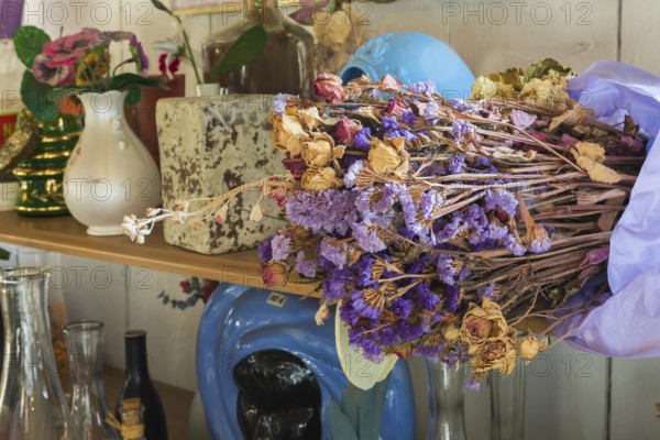 Dried flowers and curios for sale inside second hand goods and chattels store, Quebec, Canada,