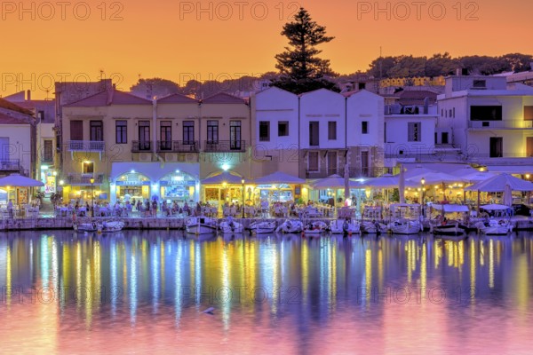 Venetian harbour, dusk, night shots, orange sky, colourful rows of houses, boats, water reflection,