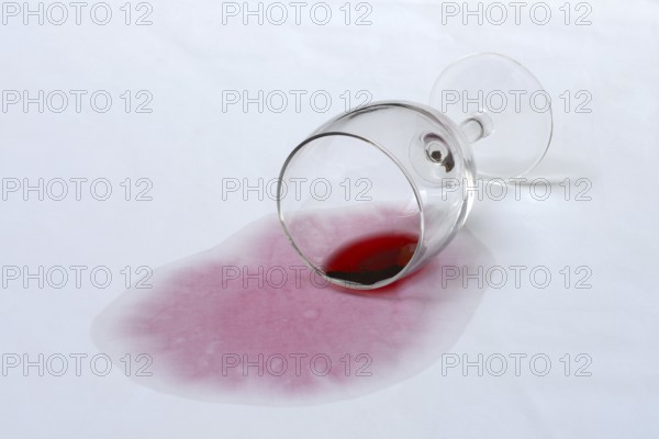 Red wine stain, overturned red wine glass on fabric, stain