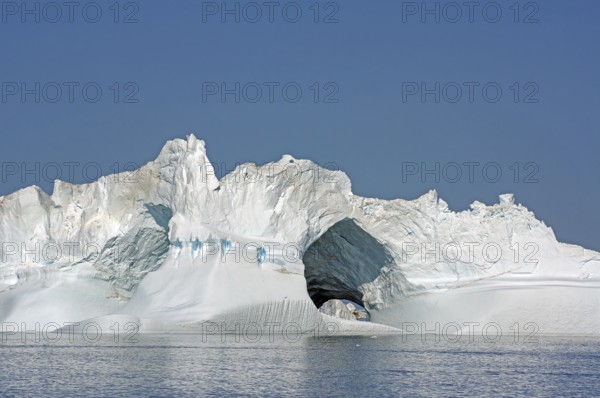 Iceberg with large ice cave, Ilulissat, Disko Bay, Denmark, Greenland, North America