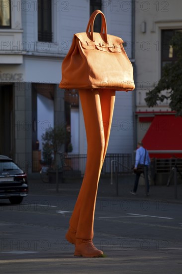 The bronze sculpture Walking Bag by Erwin Wurms at the entrance of the urban shopping zone, Bonn,