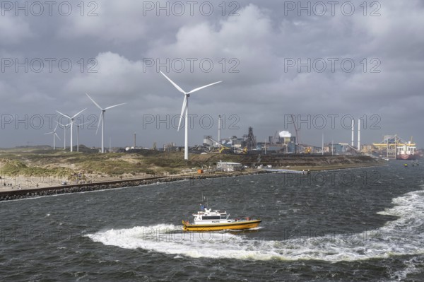Pilot ship (Aquila) Pilots operating in the North Sea, with wind turbines and the steelworks of
