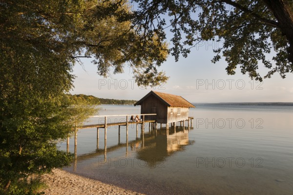 Boathouse with jetty, summer light, Herrsching am Lake Ammer, Bavaria, Germany, Europe