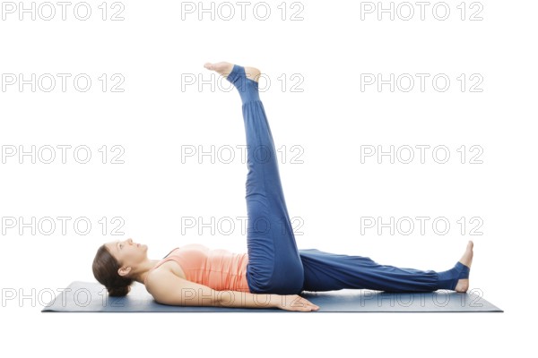Woman doing yoga asana Uttanpadasana, lying down straight leg raise pose posture isolated on white