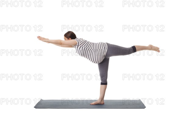 Pregnancy yoga exercise, pregnant woman doing asana virabhadrasana 3, warrior pose isolated on