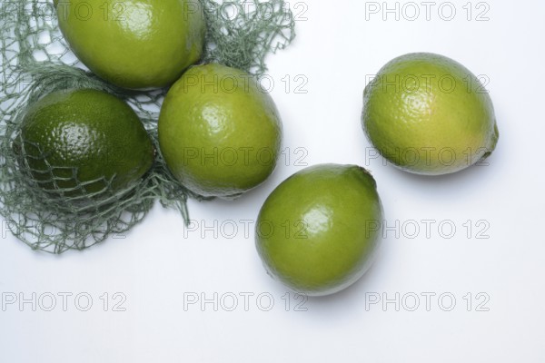 Limes with packing net, citrus fruits