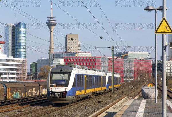 S-Bahn station, Düsseldorf-Hamm stop, Düsseldorf city centre skyline, Medienhafen, local train, NWB