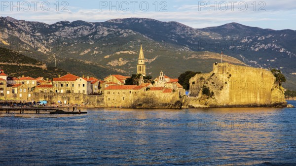 View of the old town and citadel of Budva in the evening light, Montenegro, Budva, Montenegro,