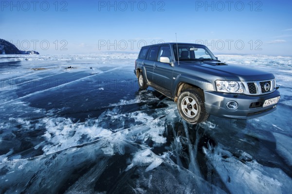 Car on ice, Lake Baikal, Olkhon Island, Pribaikalsky National Park, Irkutsk Province, Siberia,