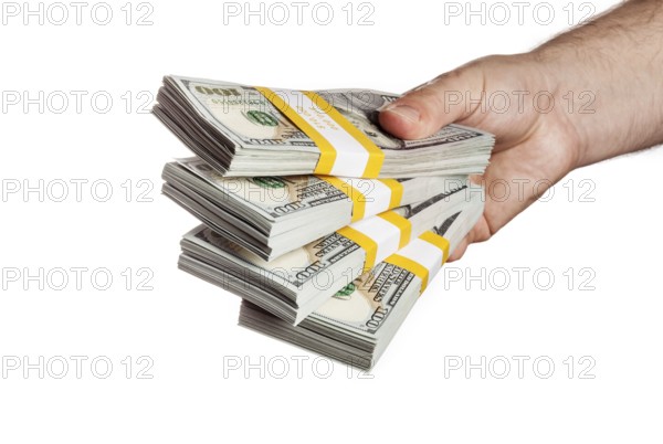 Creative business finance making money concept, hand holding stack of bundles of 100 US dollars