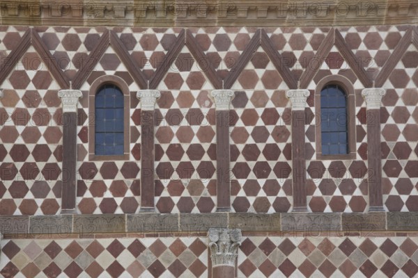 UNESCO Carolingian Monastery, façade of the King's Hall with pilasters and volutes, pattern, red,