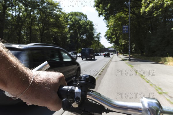 Cycling from a first-person perspective on a cycle path in Cologne, North Rhine-Westphalia,