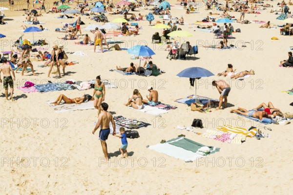 Crowded beach with people in August, San Sebastian, Donostia, Basque Country, Northern Spain,