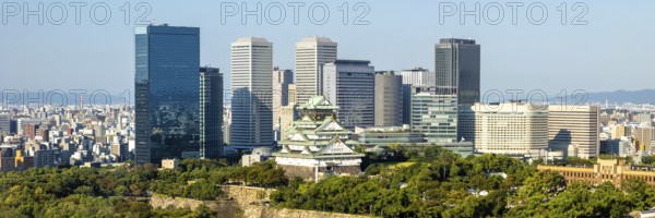 Osaka Castle Castle from above with the skyline skyscrapers panorama in Osaka, Japan, Asia