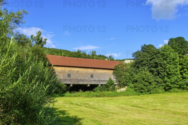 The covered wooden bridge Beuron is a historic bridge over the Danube near the Benedictine