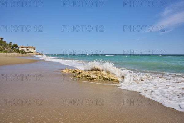 Breaking waves on a sandy beach, sunny, near Tarragona, Catalonia, Spain, Europe