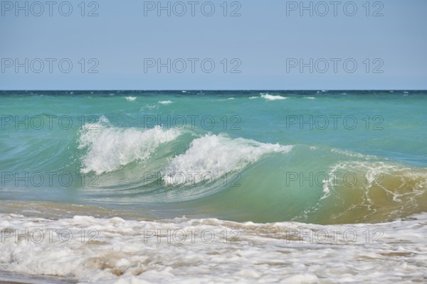 Breaking waves on a sandy beach, sunny, near Tarragona, Catalonia, Spain, Europe