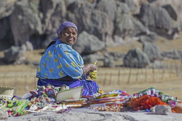 Mexican woman of the Rarámuri, Tarahumara tribe in traditional dress near the town Creel, Sierra