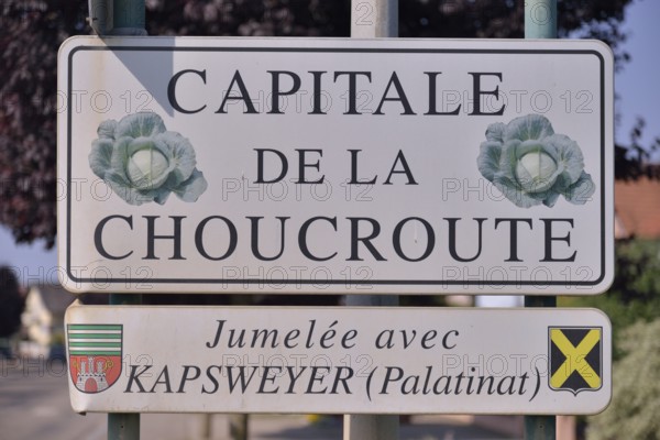 Sign "Capitale de la Choucroute", the capital of sauerkraut, on the village boundary of