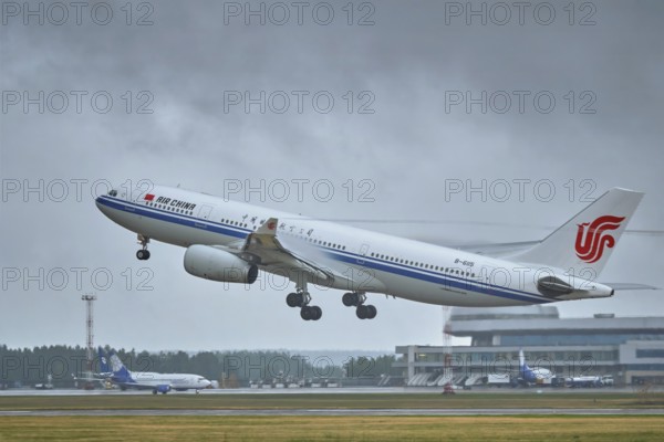 MINSK, BELARUS, JUNE 15, 2018: Air China flight Airbus A330-200 plane taking off on runway in