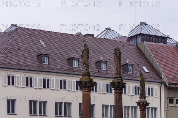 Plague pillars with patron saints in front of the main portal of Freiburg Cathedral on Münsterplatz