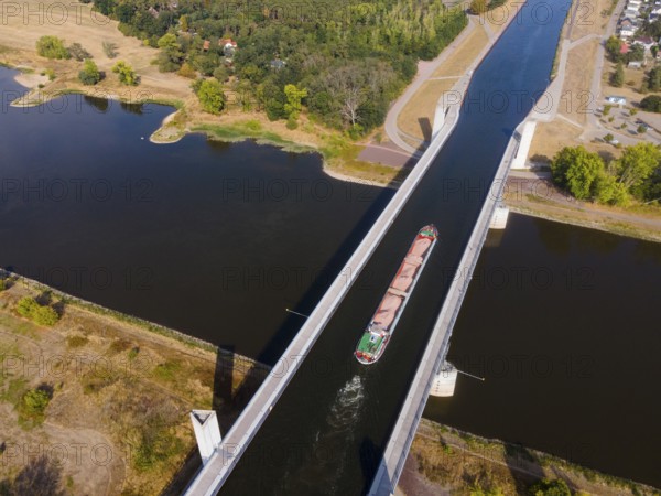 Drone shot, cargo ship on the Mittelland Canal, Magdeburg waterway junction, canal bridge,