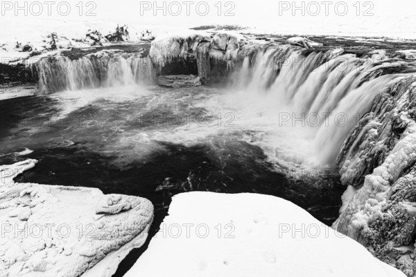 Godafoss waterfall, icy and snowy rock face, black and white photo, Northern Iceland Eyestra,