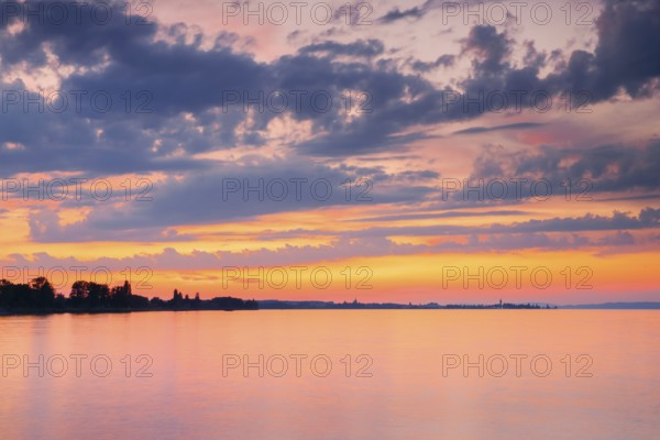 Church and harbour of Romanshorn in the evening light, view from Arbon over Lake Constance