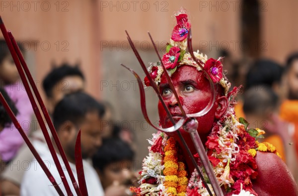 GUWAHATI, INDIA, AUGUST 19: Priest dance in the beat of Dhol (Drum) during the annual