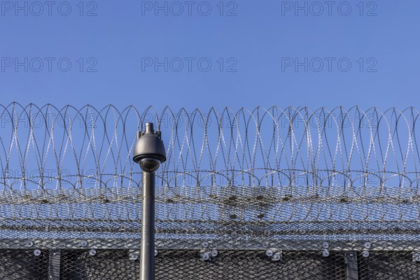 Stammheim prison, JVA. Exterior view with security fence and surveillance camera. Stuttgart,