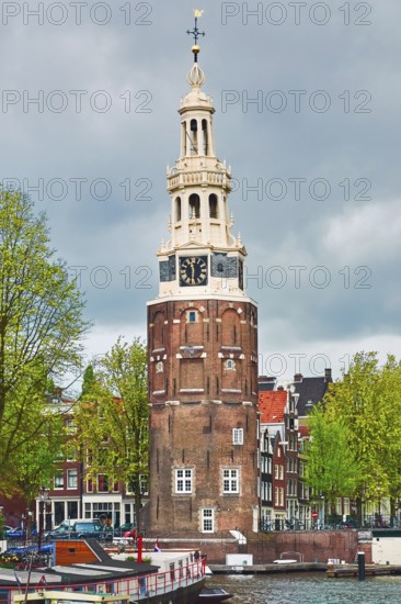 Tower (Montelbaanstoren) on the Bank of the Canal Oudeschans in Amsterdam, Netherlands Amsterdam,