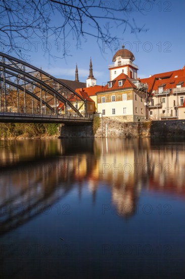 Waasenbrücke and Schwammerlturm, historic old town ensemble reflected in the river Mur, Leoben,