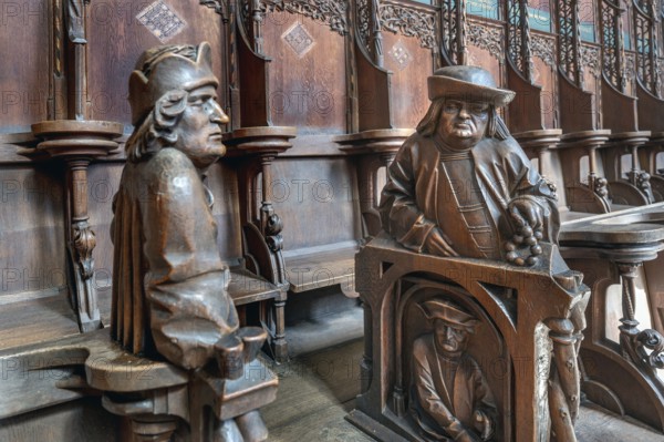 Figures on the late Gothic choir stalls from 1507, St Martin, Memmingen, Bavaria, Germany, Europe