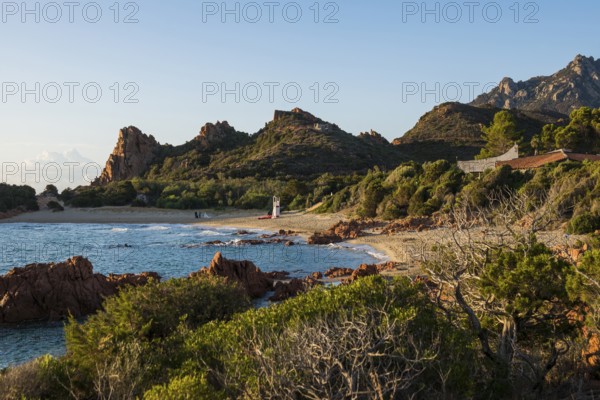 Lonely picturesque beach and red rocks, Spiaggia Su Sirboni, sunrise, near Tertenia, Province of