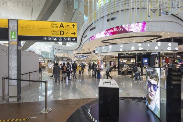 Abu Dhabi Airport, Zayed International Airport with passengers. Duty free shop. The new Terminal A