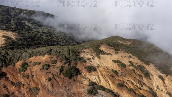 Clouds of fog, yellow earth, erosion, near Arguamul, La Gomera, Canary Islands, Spain, Europe
