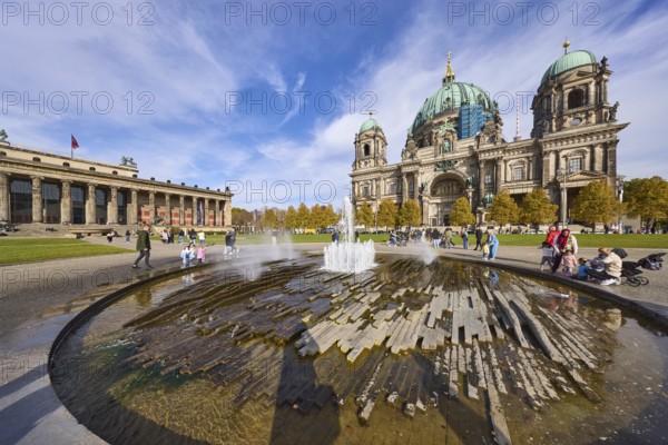 Fountain in the Lustgarten, Altes Museum and Berlin Cathedral under a blue sky with cumulus and