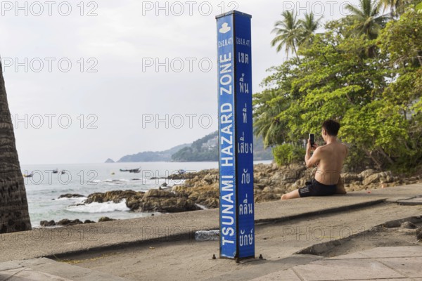 Tsunami Hazard Zone. Warning sign, signposting of escape routes in the event of another seaquake.