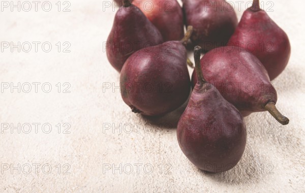 Red pears scattered on the table, barletta pear, selective focus, no people
