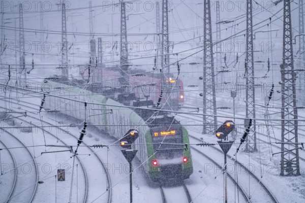 Winter weather, heavy snowfall, railway tracks in front of Essen main station, S-Bahn train, North