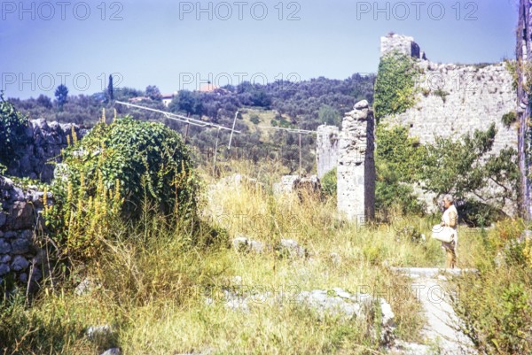 Woman tourist standing in ruins of Old Town, Stari Bar, Montenegro, former Yugoslavia, Europe 1970,