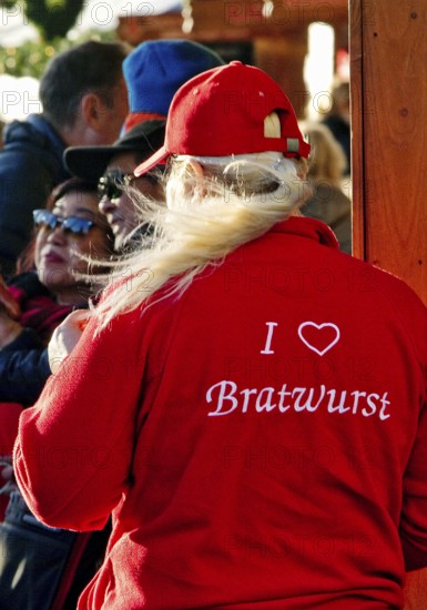 I love Bratwurst, print on the red clothing of a saleswoman at the Christmas market, Düsseldorf,